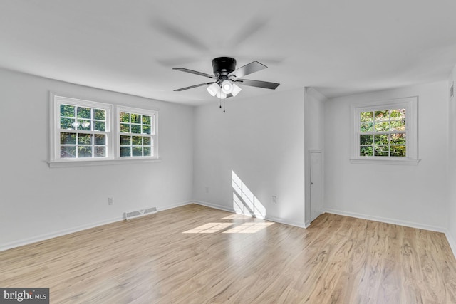 spare room featuring ceiling fan and light wood-type flooring