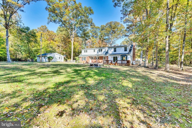 view of yard with a wooden deck