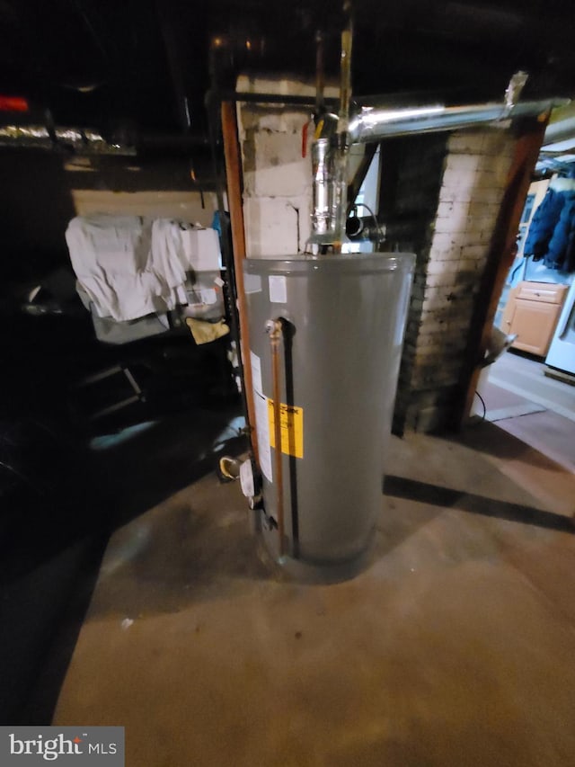 utility room with gas water heater