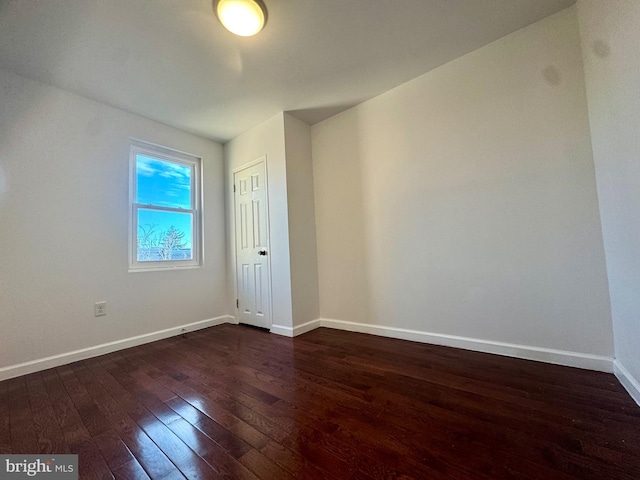 empty room featuring dark hardwood / wood-style floors