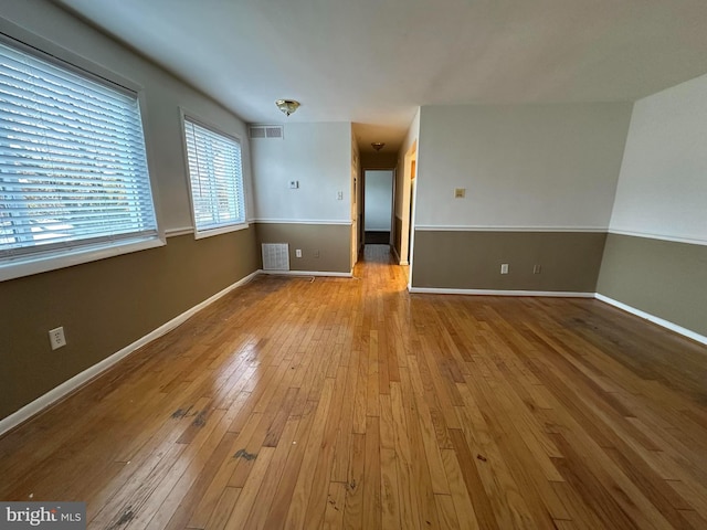 spare room featuring light wood-type flooring