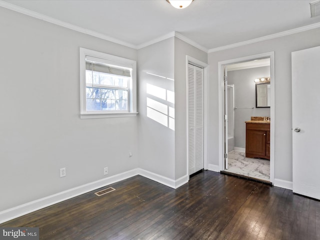 interior space featuring crown molding and dark hardwood / wood-style floors