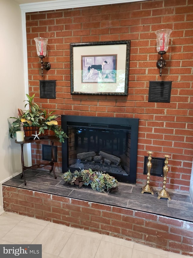 interior details featuring a brick fireplace