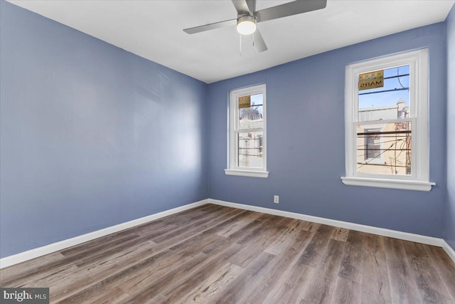 unfurnished room featuring wood-type flooring and ceiling fan