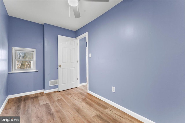 spare room with ceiling fan and light hardwood / wood-style flooring