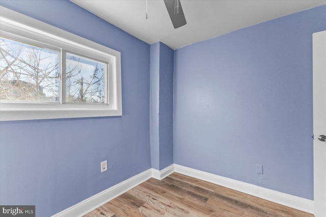 empty room with hardwood / wood-style flooring