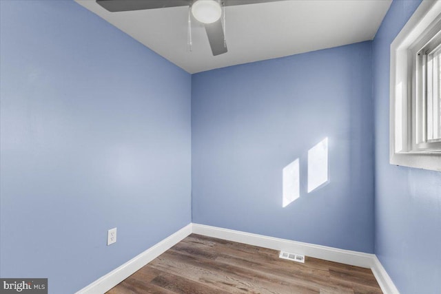 empty room featuring ceiling fan and hardwood / wood-style flooring