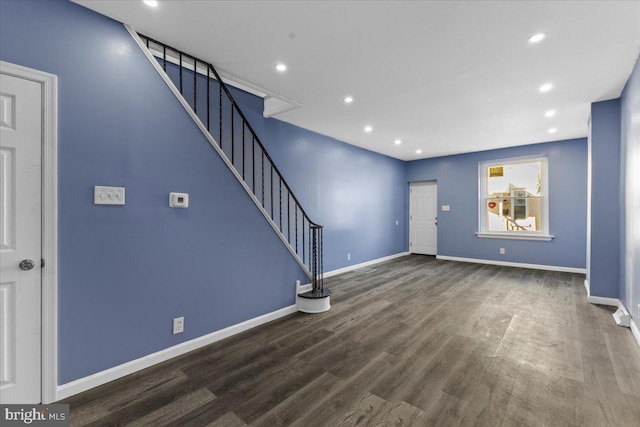 unfurnished living room with hardwood / wood-style flooring