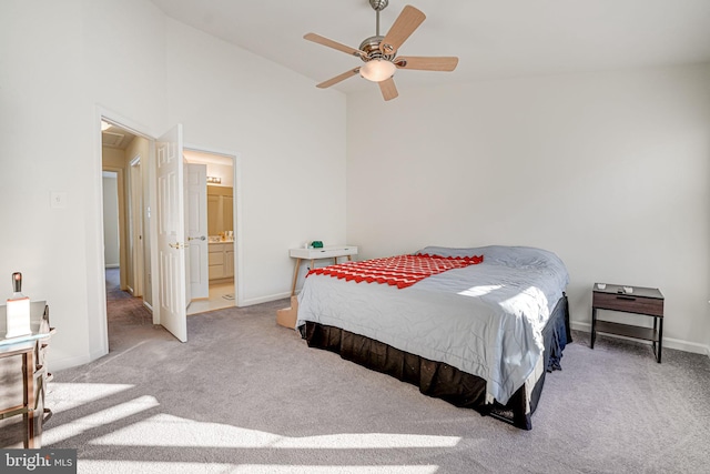 carpeted bedroom with ceiling fan and ensuite bathroom