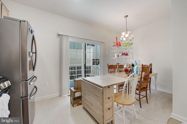 dining space featuring a notable chandelier