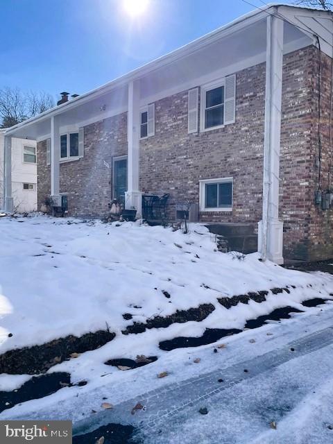 view of snow covered house