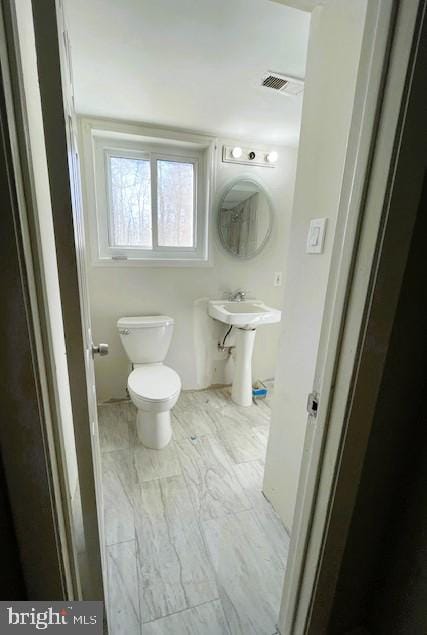 bathroom featuring toilet