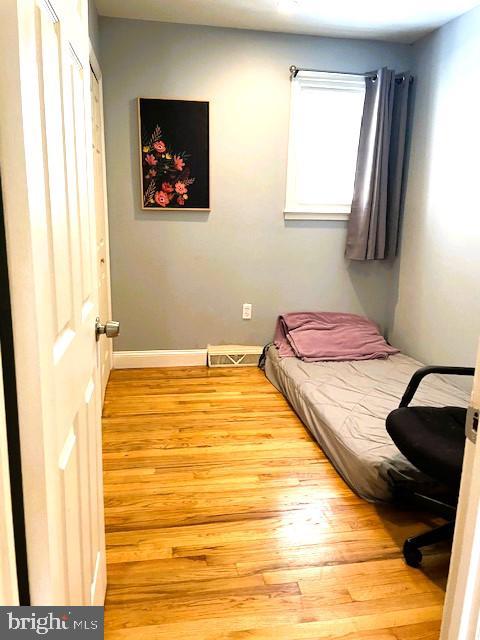 bedroom with light hardwood / wood-style flooring