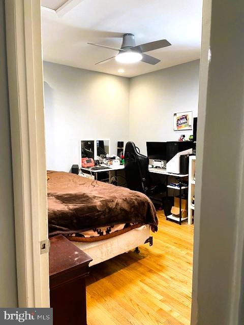 bedroom featuring ceiling fan and hardwood / wood-style floors