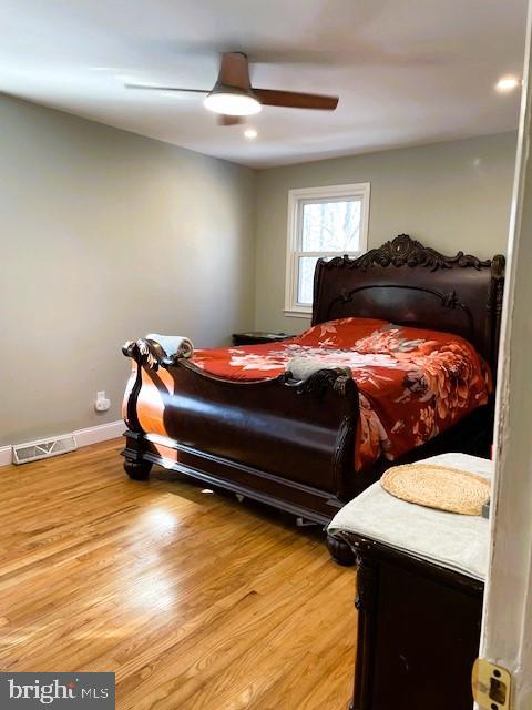 bedroom featuring ceiling fan and hardwood / wood-style floors