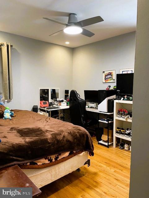 bedroom featuring ceiling fan and wood-type flooring