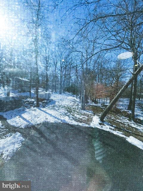 view of yard layered in snow