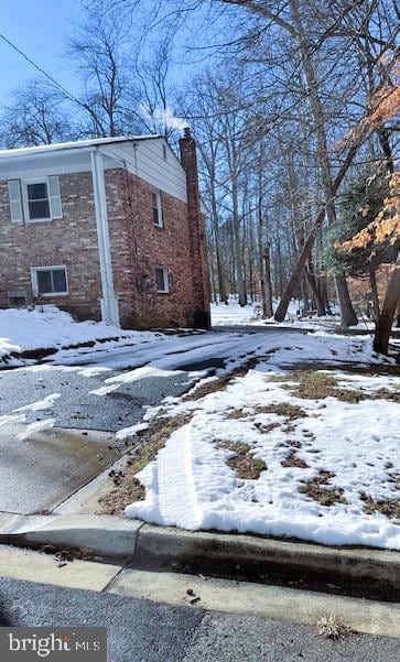 view of snow covered property