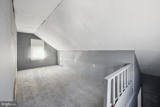 bonus room with carpet and lofted ceiling