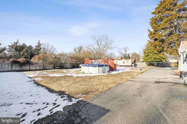 view of yard with a covered pool