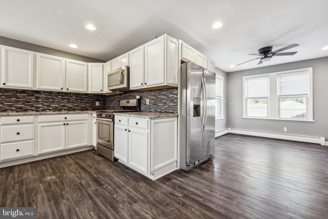 kitchen featuring ceiling fan, white cabinetry, stainless steel appliances, dark hardwood / wood-style flooring, and a baseboard radiator