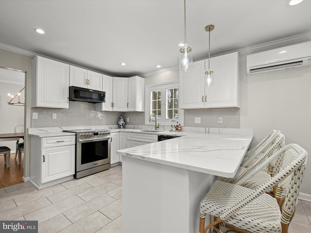 kitchen with white cabinetry, black appliances, and a wall mounted air conditioner