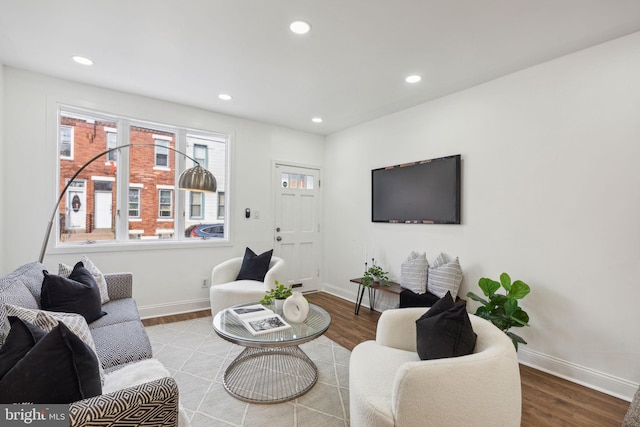 living room with light hardwood / wood-style flooring