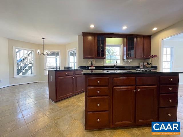 kitchen with hanging light fixtures, a chandelier, and a kitchen island