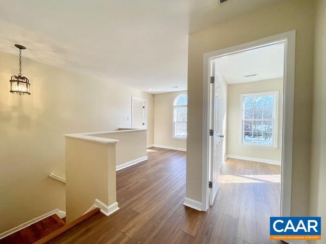 corridor featuring hardwood / wood-style flooring