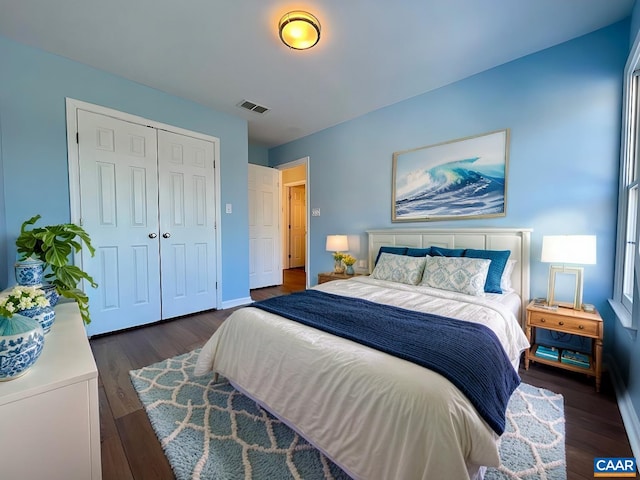 bedroom featuring a closet and dark hardwood / wood-style floors