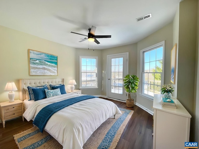 bedroom featuring ceiling fan, dark hardwood / wood-style floors, and access to outside