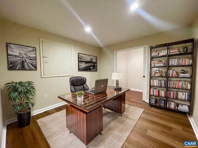 office space with hardwood / wood-style floors