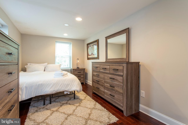 bedroom featuring dark hardwood / wood-style flooring