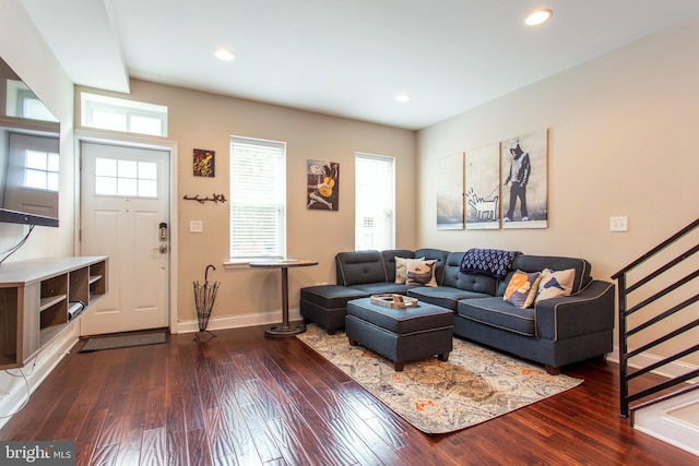 living room featuring dark hardwood / wood-style flooring