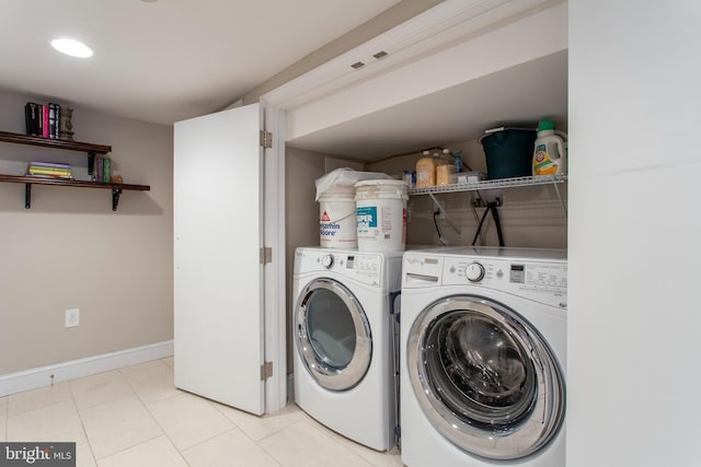 clothes washing area featuring washer and clothes dryer