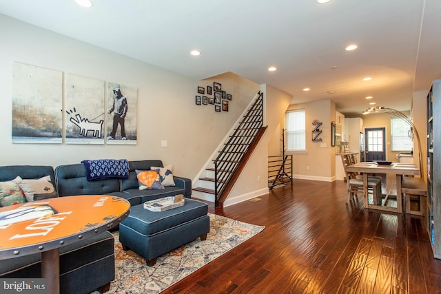 living room with dark hardwood / wood-style flooring