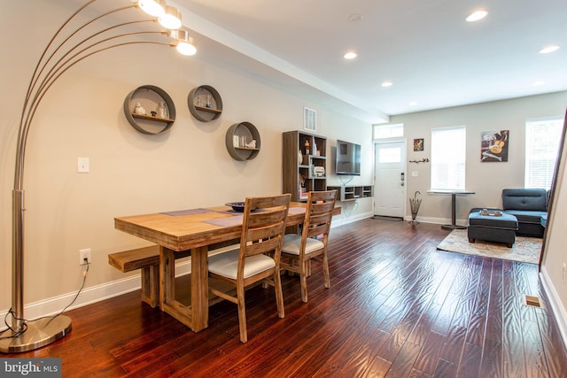 dining area with dark hardwood / wood-style floors