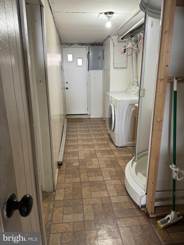 laundry room with electric panel and independent washer and dryer