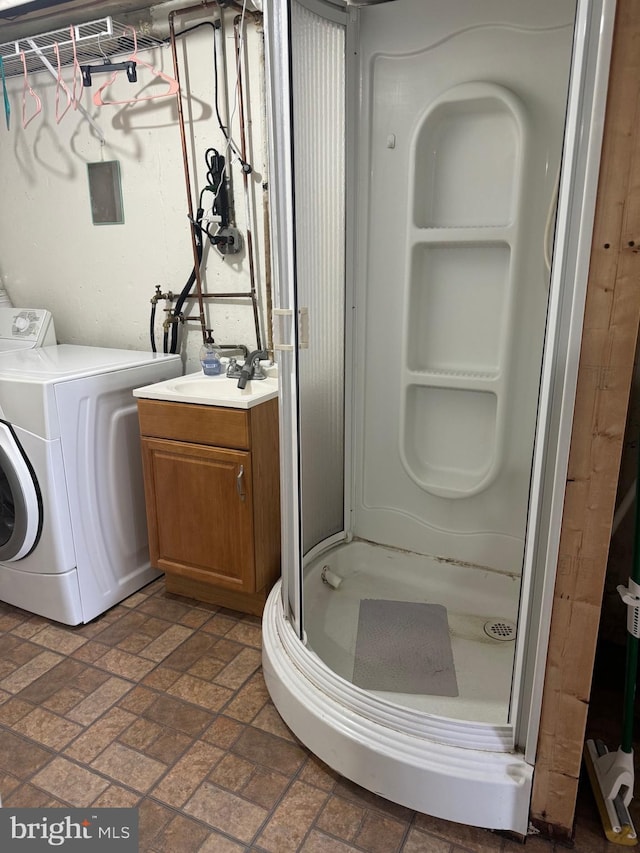 washroom featuring sink and washer / clothes dryer