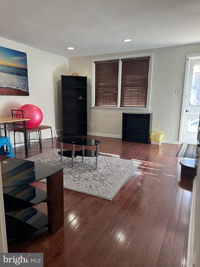 living room with dark wood-type flooring