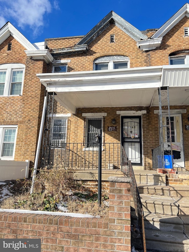 view of property with a porch