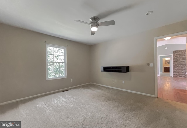 unfurnished room featuring ceiling fan and carpet flooring