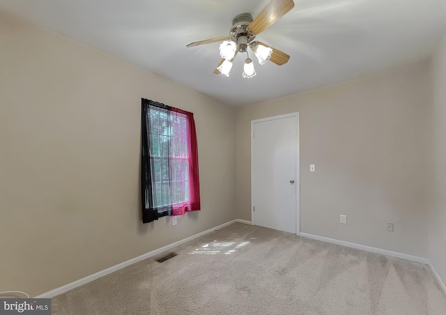 carpeted empty room with ceiling fan