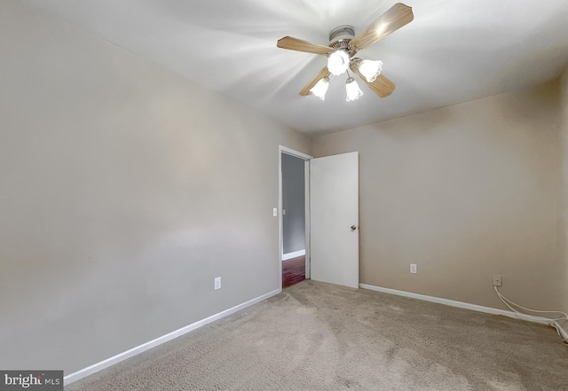 carpeted empty room with ceiling fan