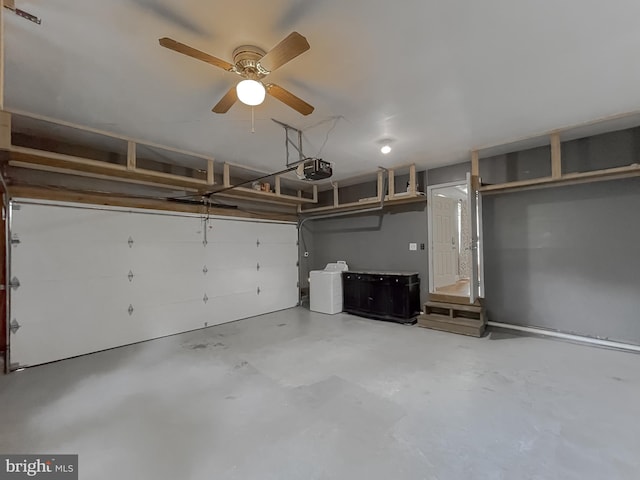 garage with ceiling fan and a garage door opener