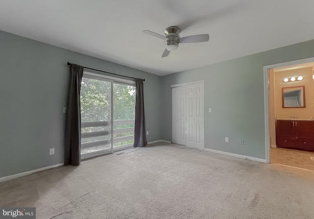 carpeted empty room with ceiling fan