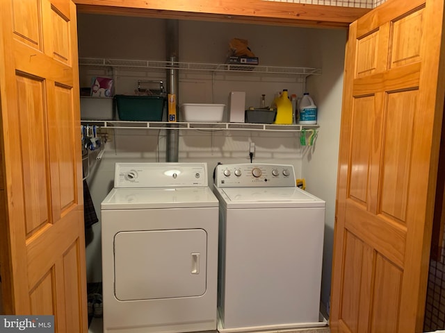 laundry area with separate washer and dryer