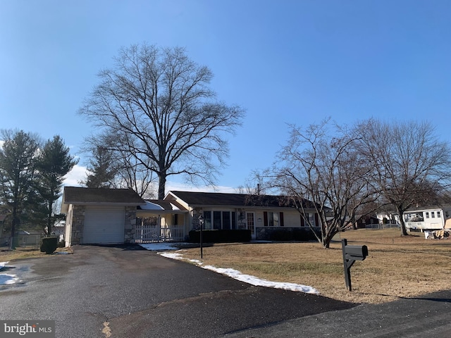 single story home with a front lawn and a garage