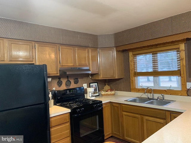 kitchen with sink and black appliances