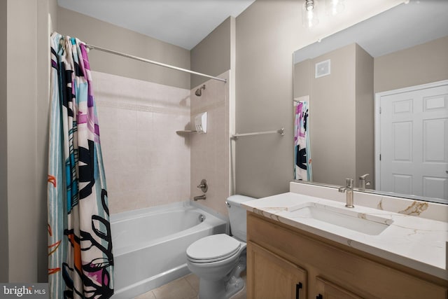 full bathroom featuring shower / bath combination with curtain, tile patterned floors, vanity, and toilet